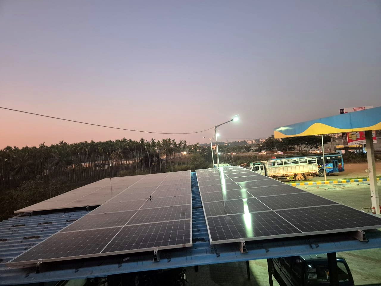 Solar panels on a shed roof at dusk in Bangalore