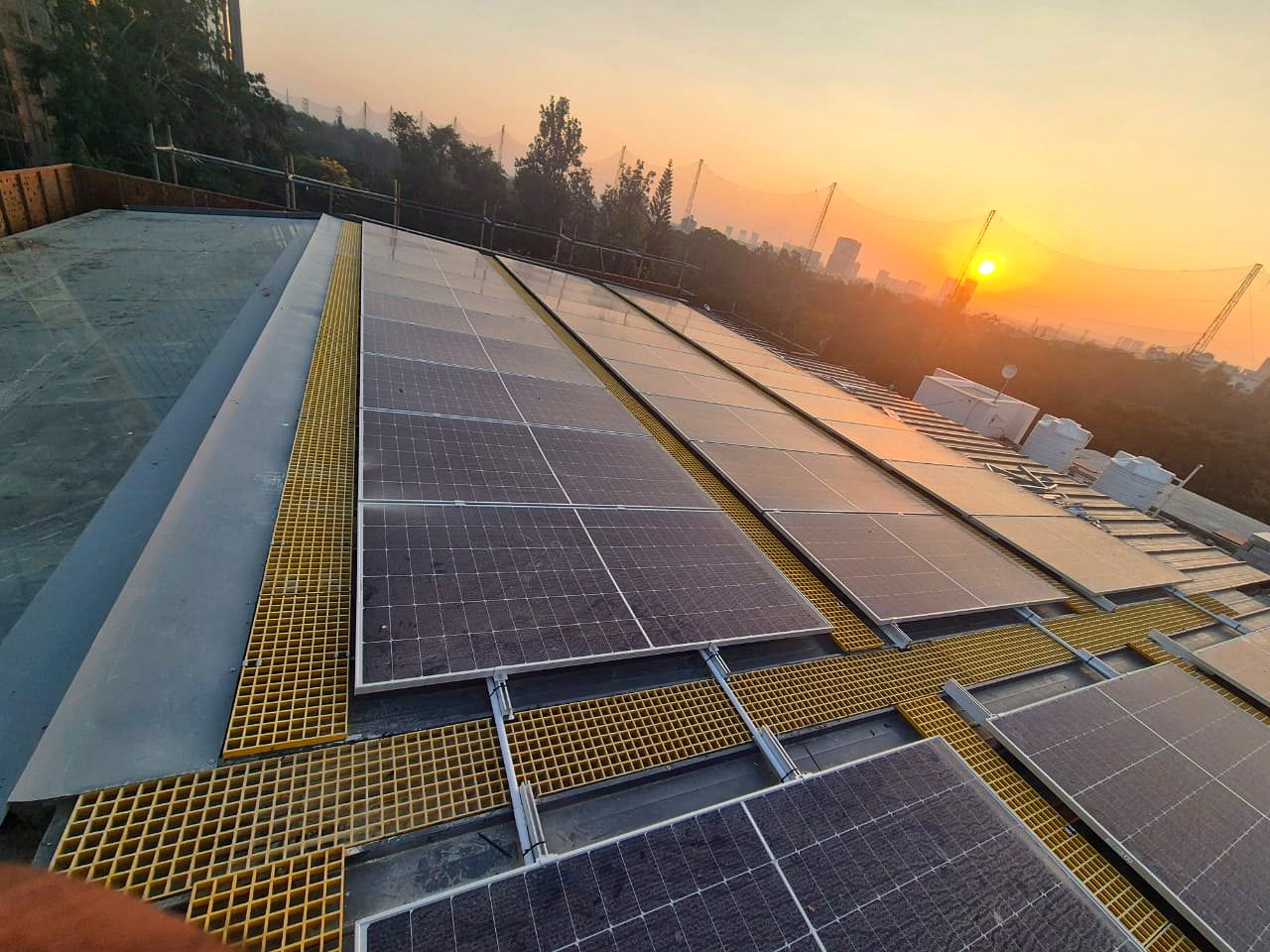 Rooftop solar array with maintenance walkways in Bangalore