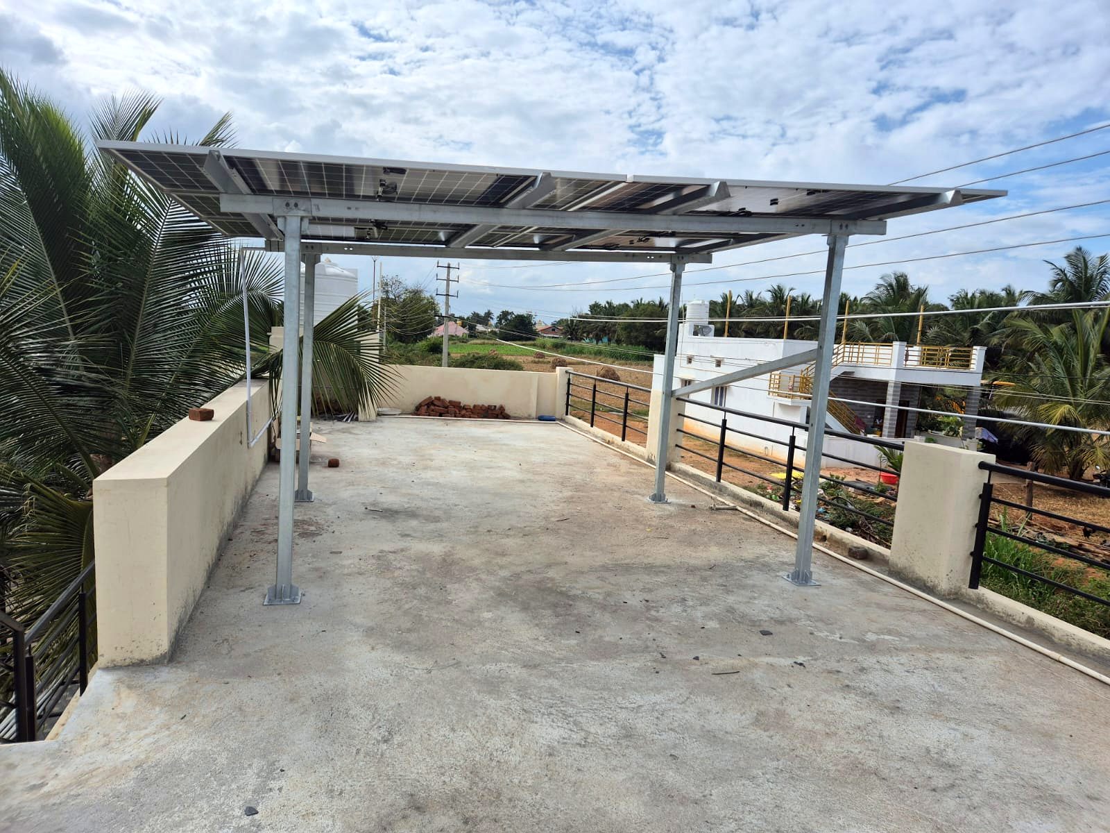 Completed rooftop solar array on a Bangalore home terrace